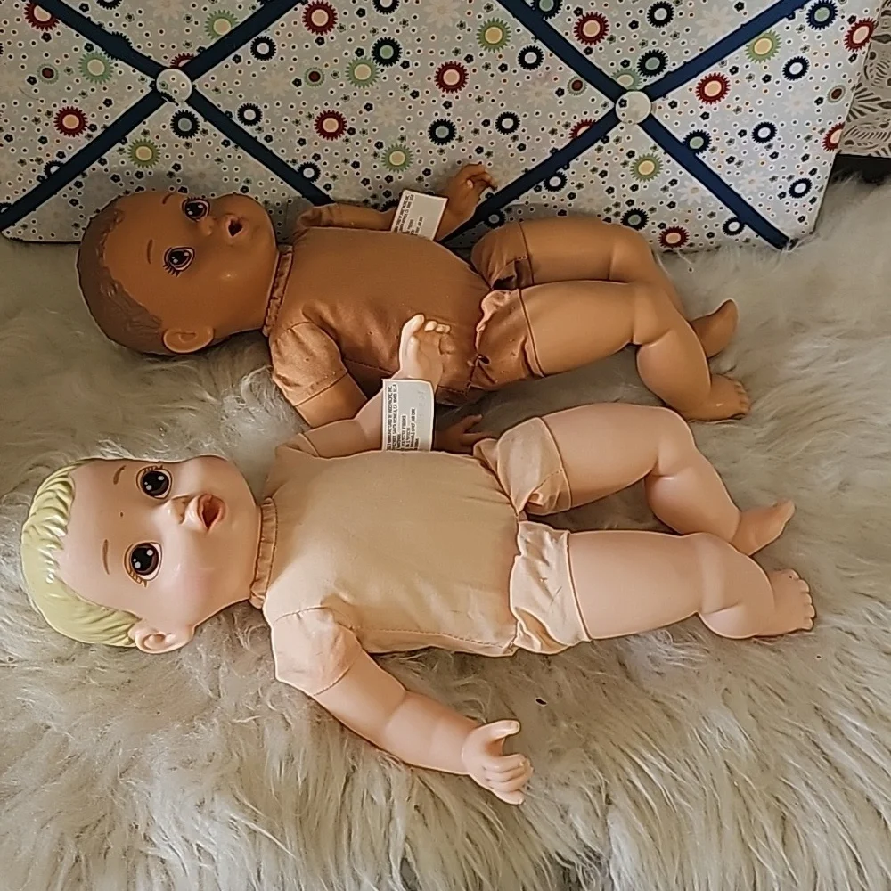 2 cute soft body dolls blonde hair and dark